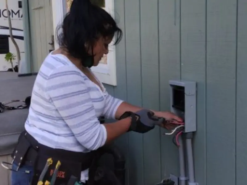 Licensed electrician wiring an exterior subpanel in Atascadero